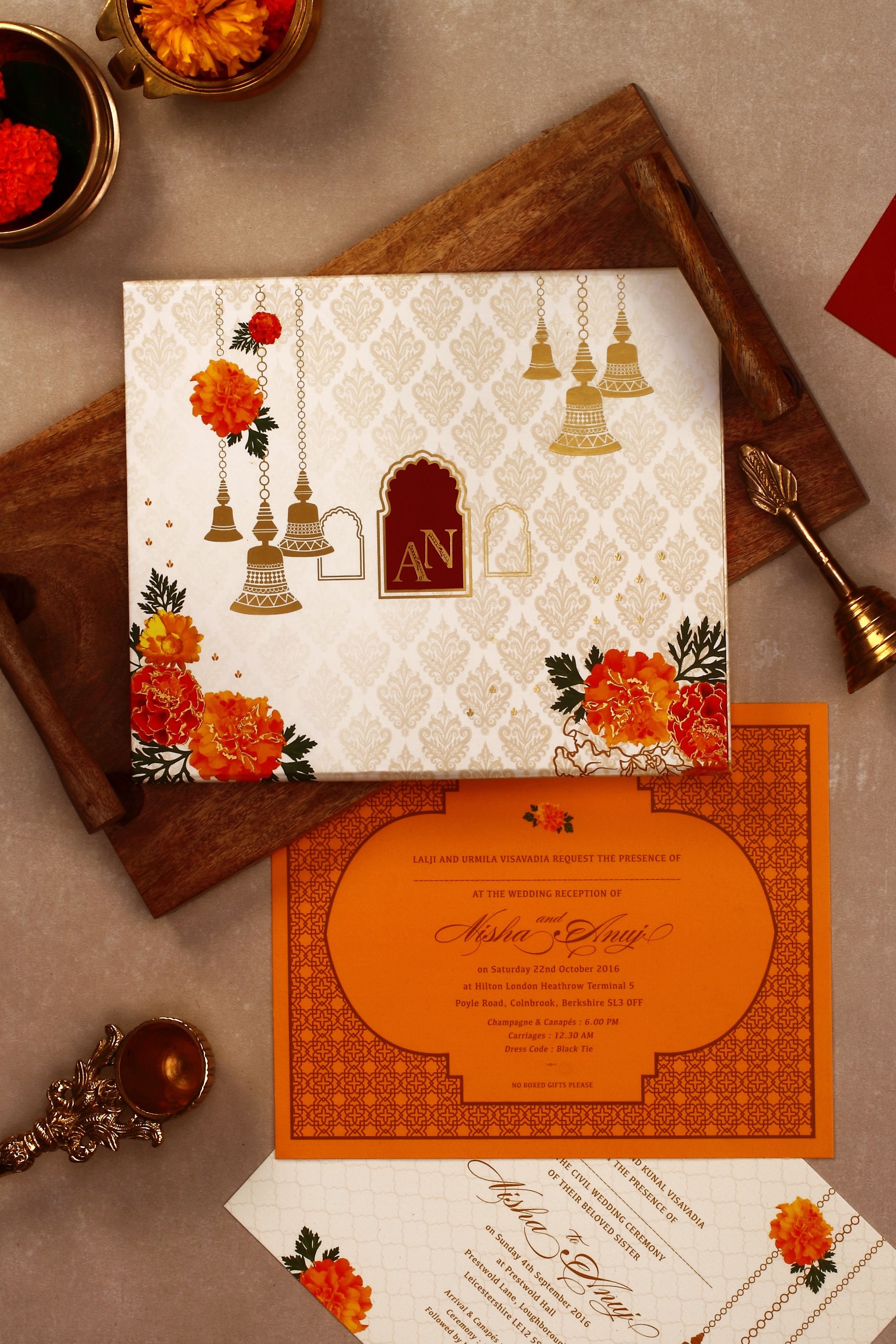 Marigold and Brass bells Indian wedding invitation #indianwedding #